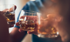 A group of people drink alcohol
