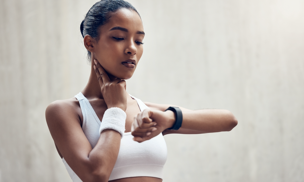 Woman checking her resting heart rate